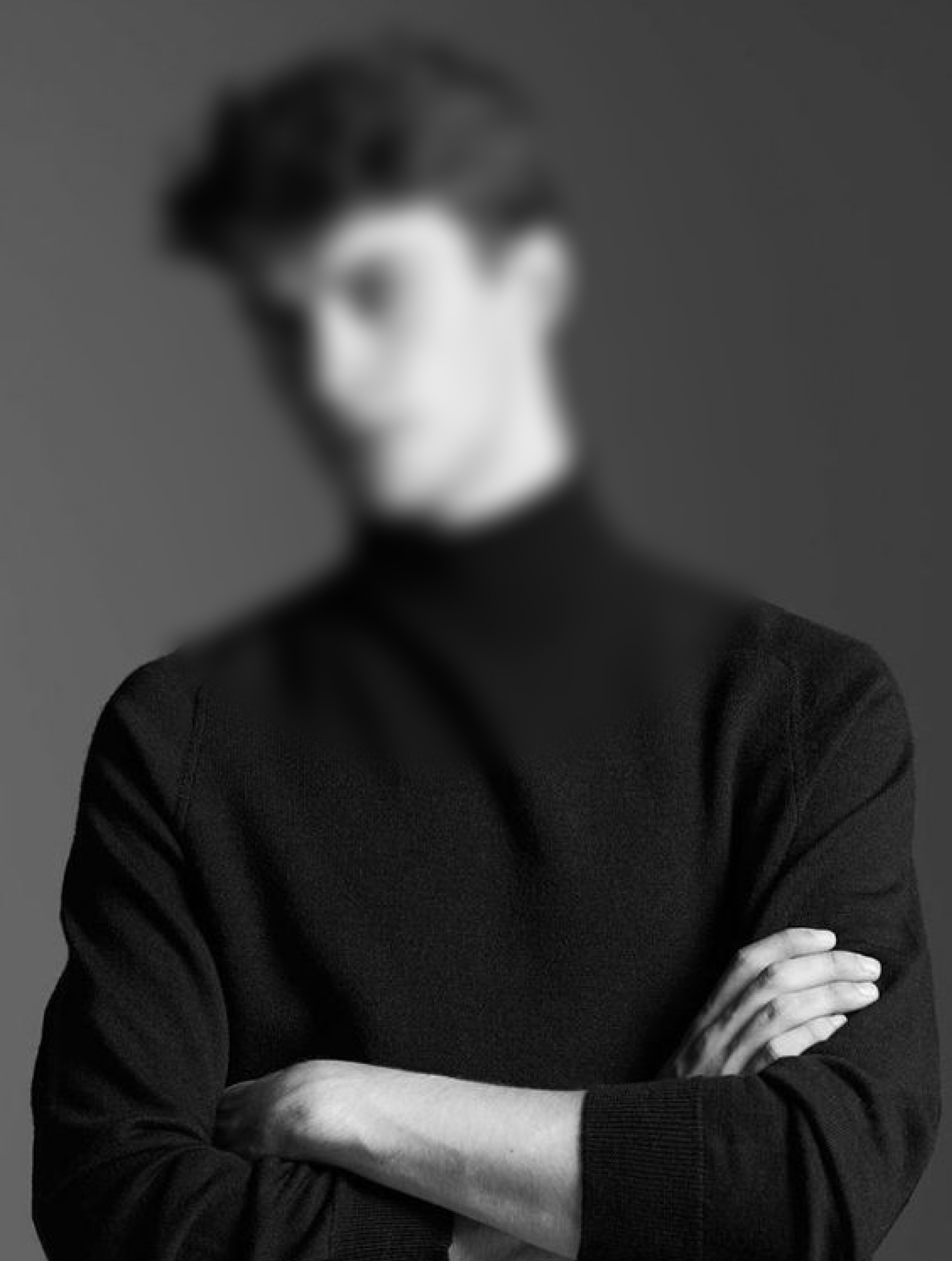 A stylish and young male wearing a black sweater